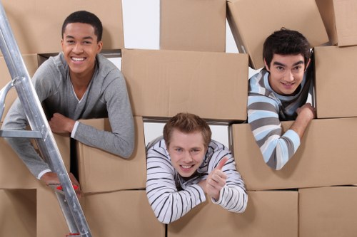 Professional movers packing office equipment for Ealing relocation
