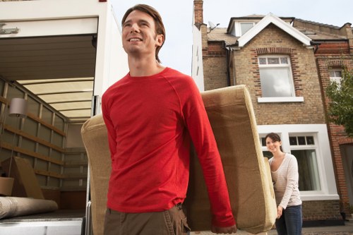 Careful packing of fragile household items for relocation