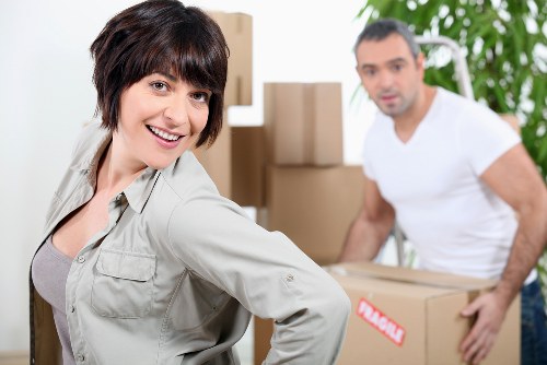 Team packing office equipment for a business move in Ealing