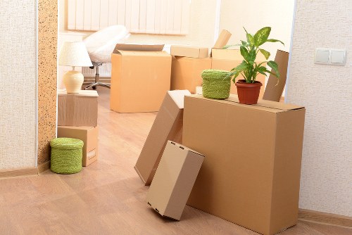 Well-labelled moving boxes and packing materials ready for transport