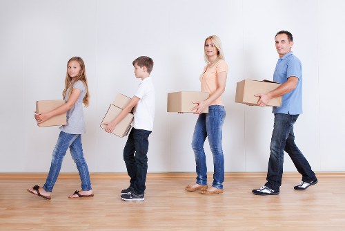 Office relocation setup with boxes and equipment in Ealing